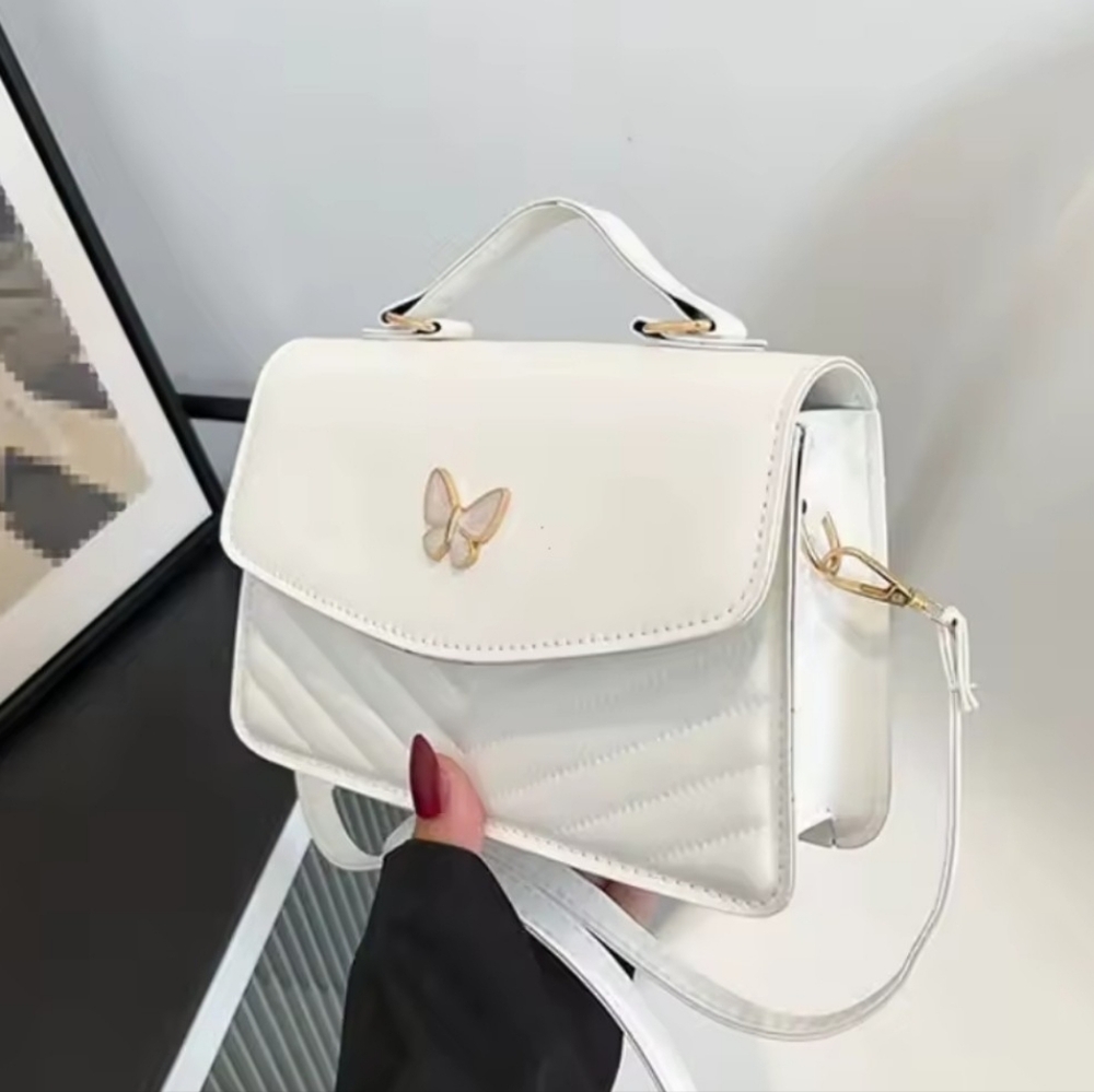Chic White Crossbody Bag with Butterfly Detail